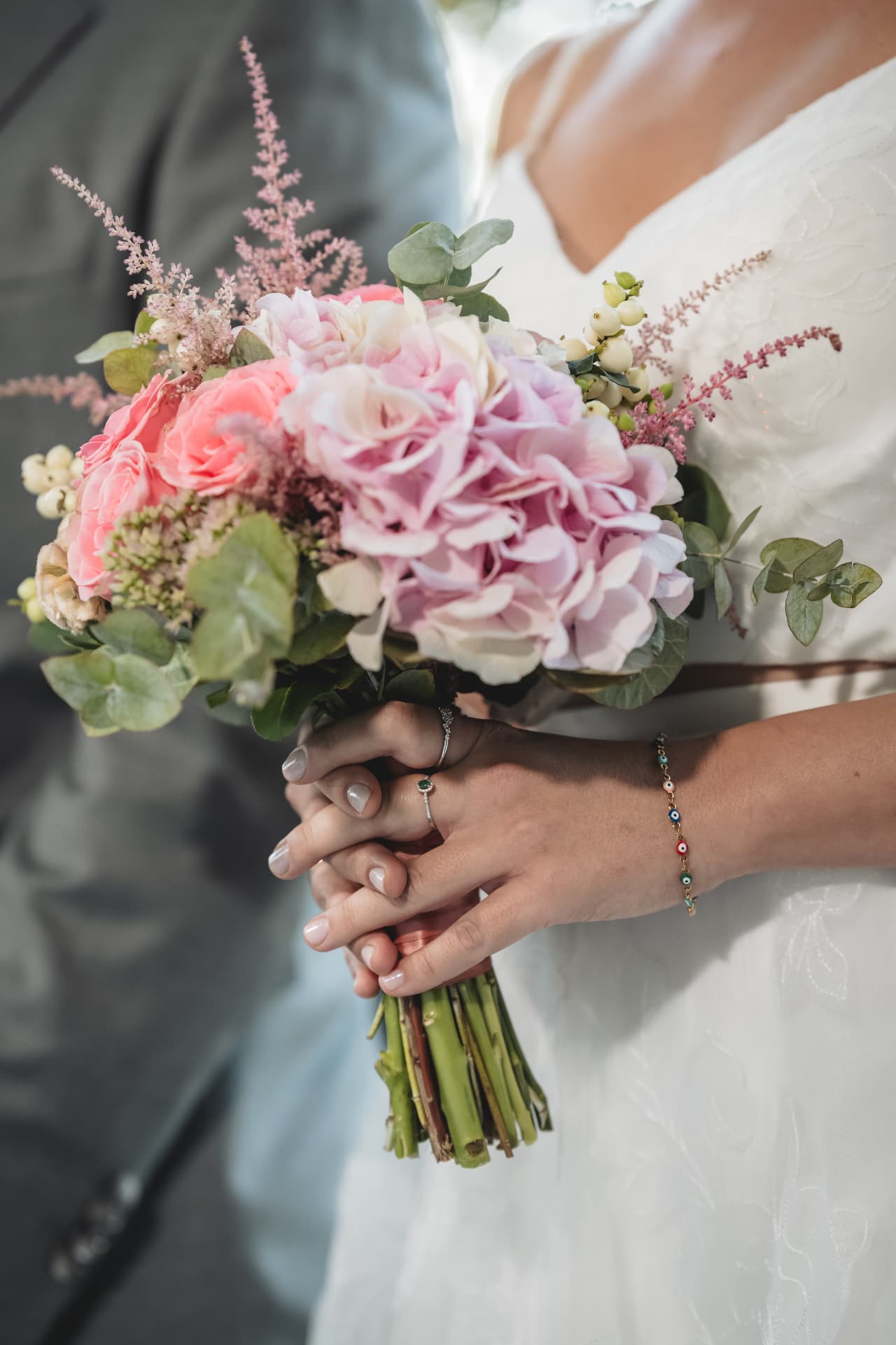 Bridal bouquet with pink and peach blooms at Lagonissi Falls